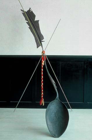 hammered steel sculpture of spoon and feather